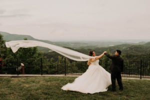 Bride and Groom dancing on mountain