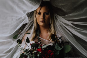 bride in veil with bouquet